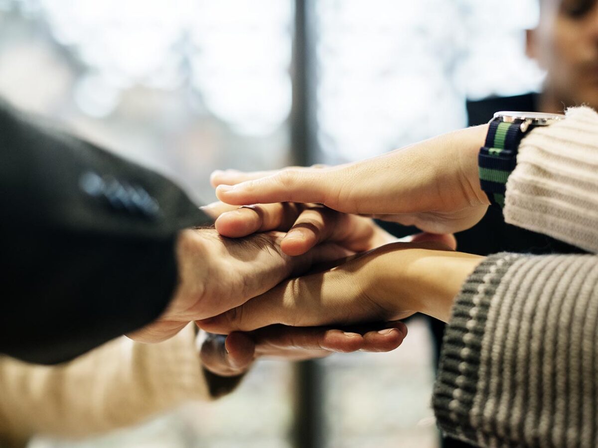 diverse-people-stacking-hands-together-1200x900.jpg